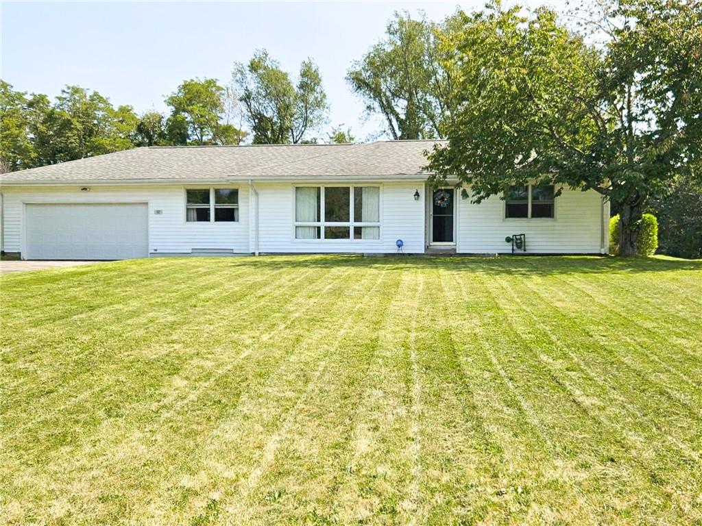 112 Reed Drive Industry, PA 15052 - Photo 2 of 38 a view of a house with pool and a garden