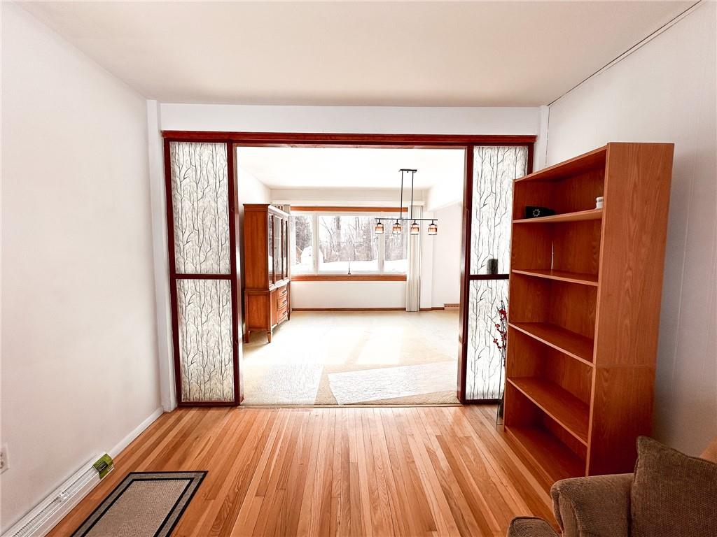 112 Reed Drive Industry, PA 15052 - Photo 24 of 38 a view of empty room with wooden floor and fan