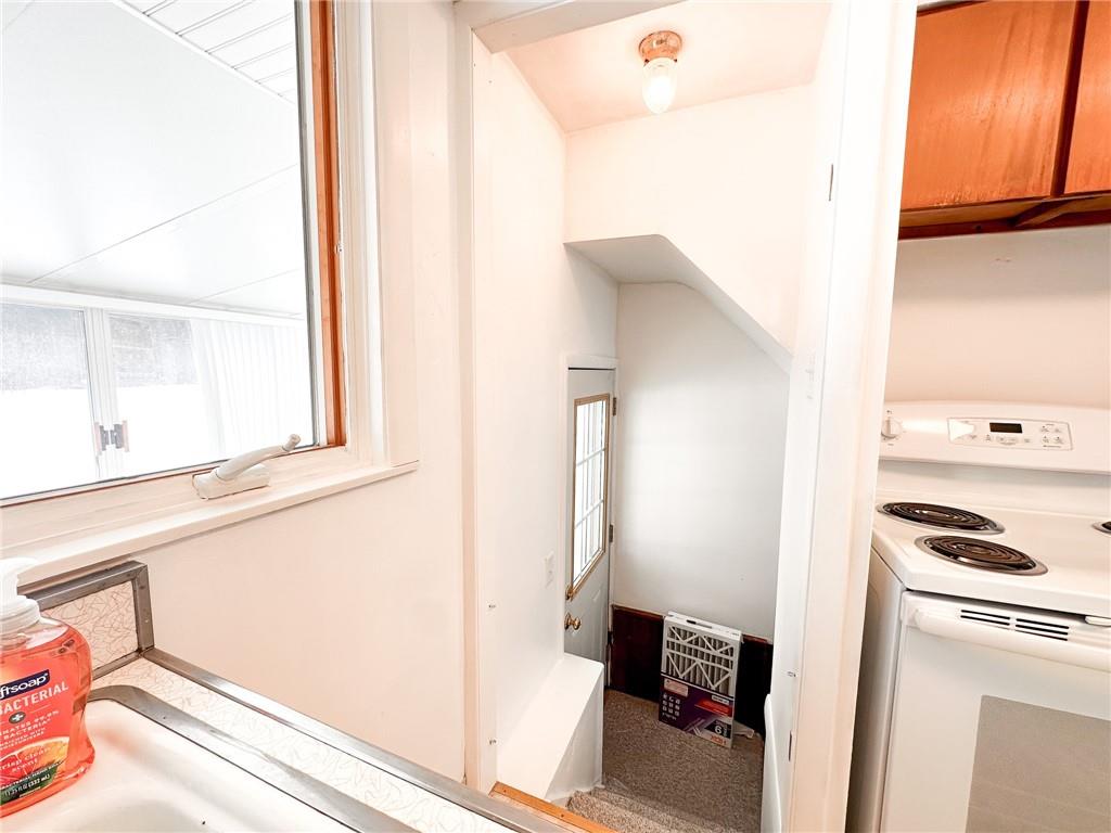 112 Reed Drive Industry, PA 15052 - Photo 25 of 38 a kitchen with a refrigerator and a window