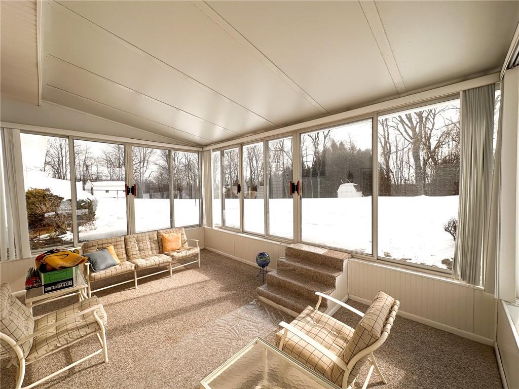 112 Reed Drive Industry, PA 15052 - Photo 29 of 38 a living room with furniture and floor to ceiling windows