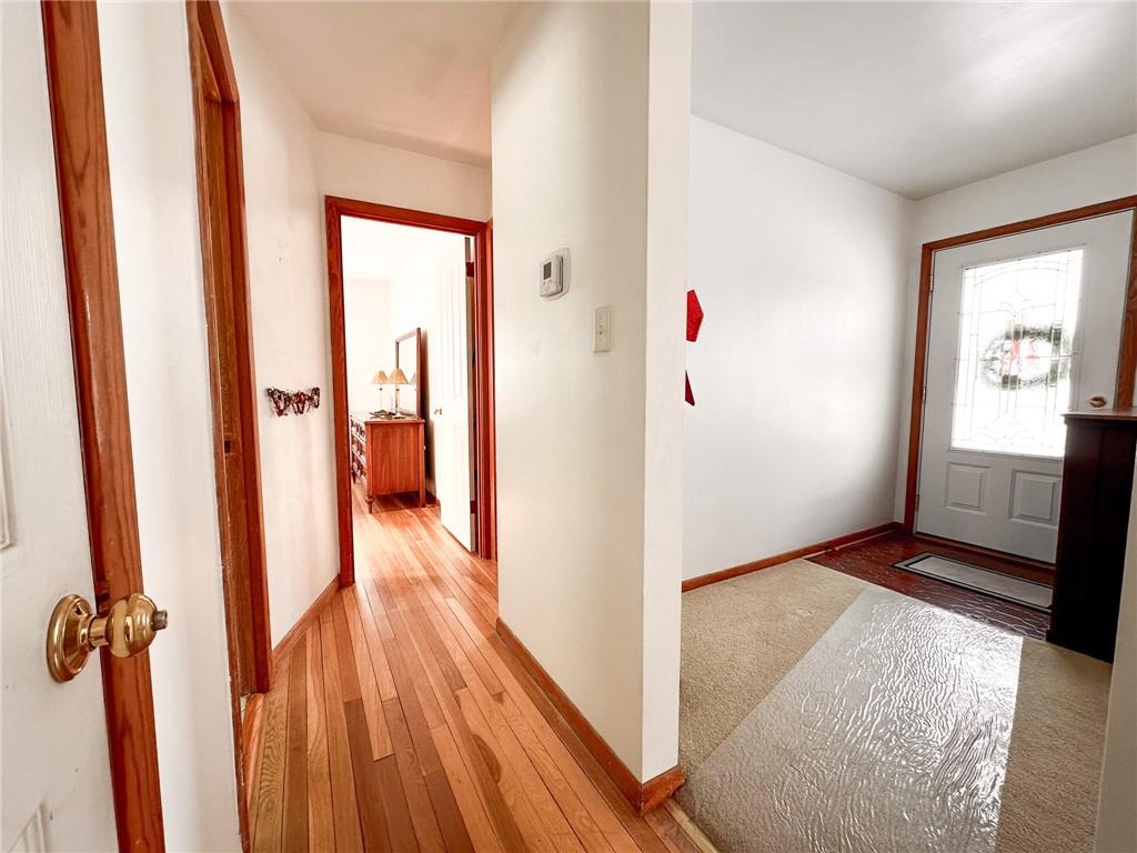 112 Reed Drive Industry, PA 15052 - Photo 8 of 38 a view of a hallway with wooden floor and closet