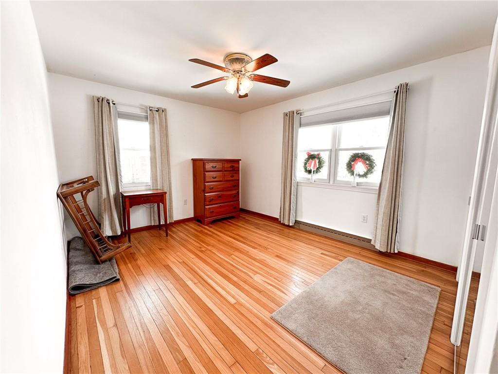 112 Reed Drive Industry, PA 15052 - Photo 10 of 38 a view of a livingroom with furniture and a ceiling fan