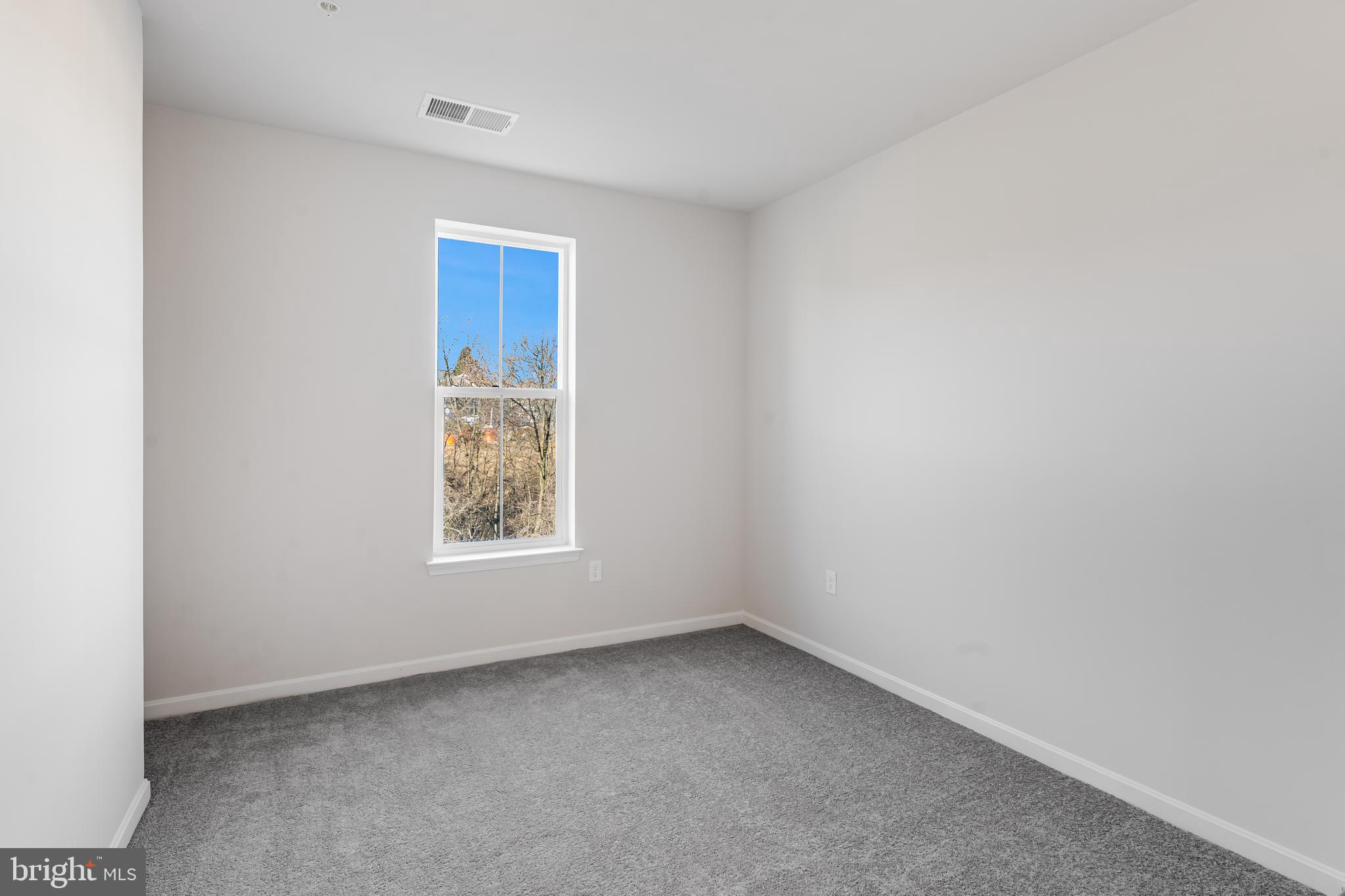 4003 Seaside Alder Road, Unit 204 VIOLET Bowie, MD 20720 - Photo 7 of 17 a view of an empty room with a window