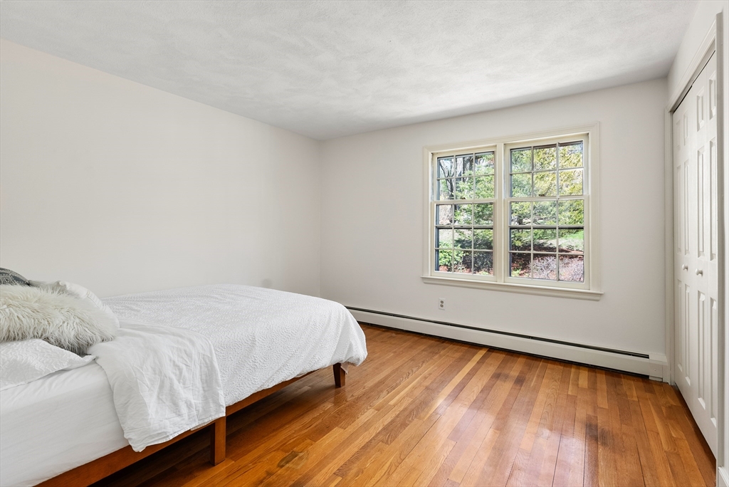 39 Dakin Road Sudbury, MA 01776 - Photo 18 of 34 a bed sitting in a bedroom next to a window