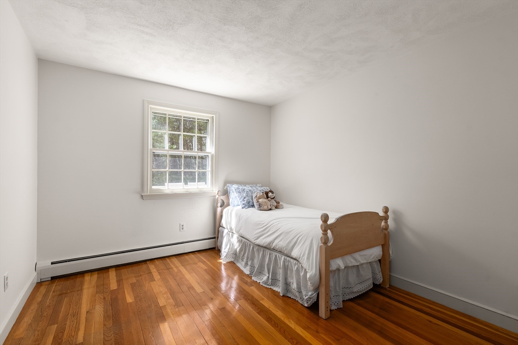 39 Dakin Road Sudbury, MA 01776 - Photo 21 of 34 a bedroom with a bed and a window