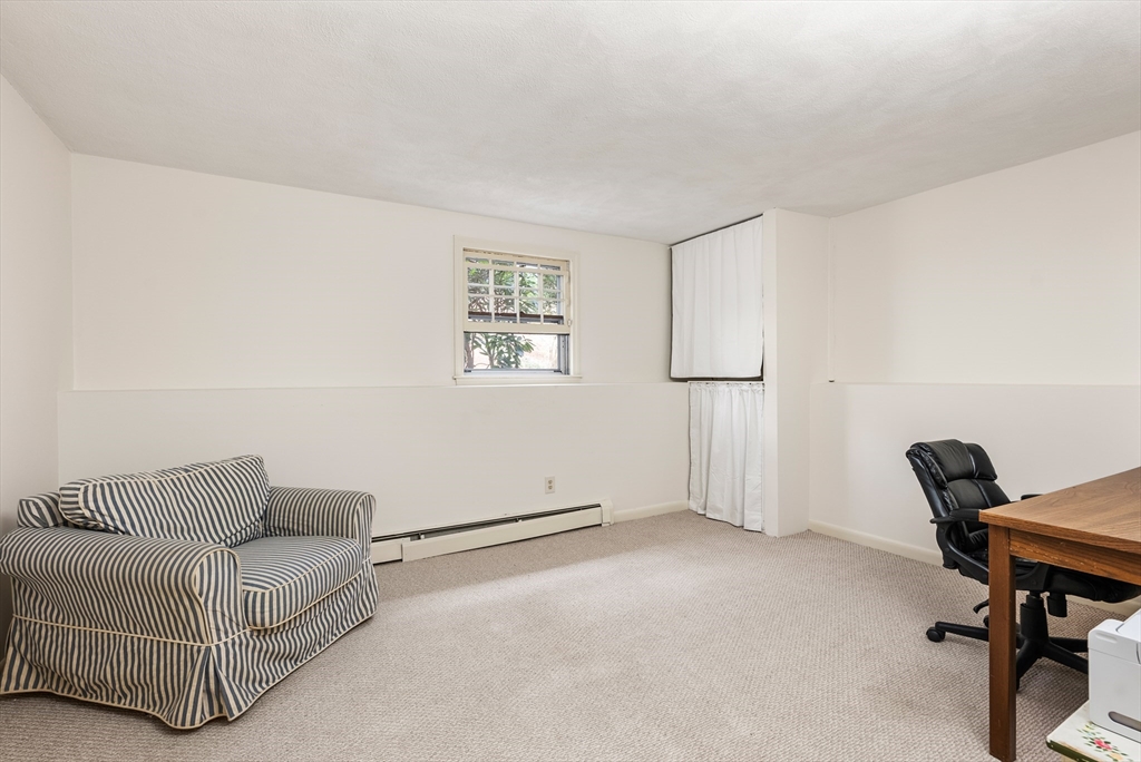 39 Dakin Road Sudbury, MA 01776 - Photo 27 of 34 a living room with furniture and a window