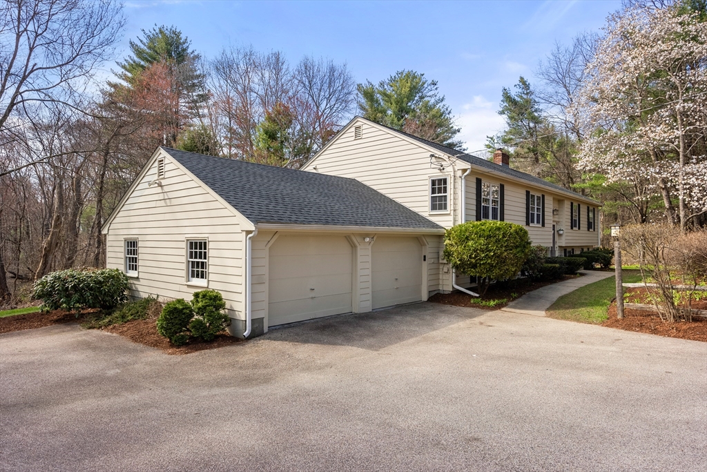 39 Dakin Road Sudbury, MA 01776 - Photo 32 of 34 a view of a house with a yard and potted plants