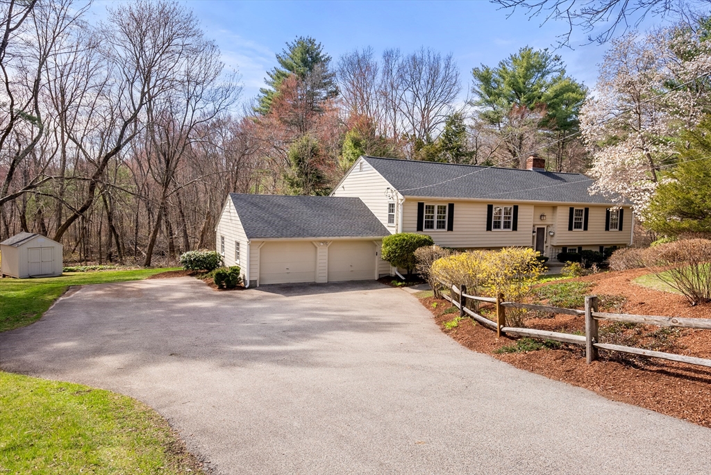 39 Dakin Road Sudbury, MA 01776 - Photo 33 of 34 a view of a house with a yard and garage