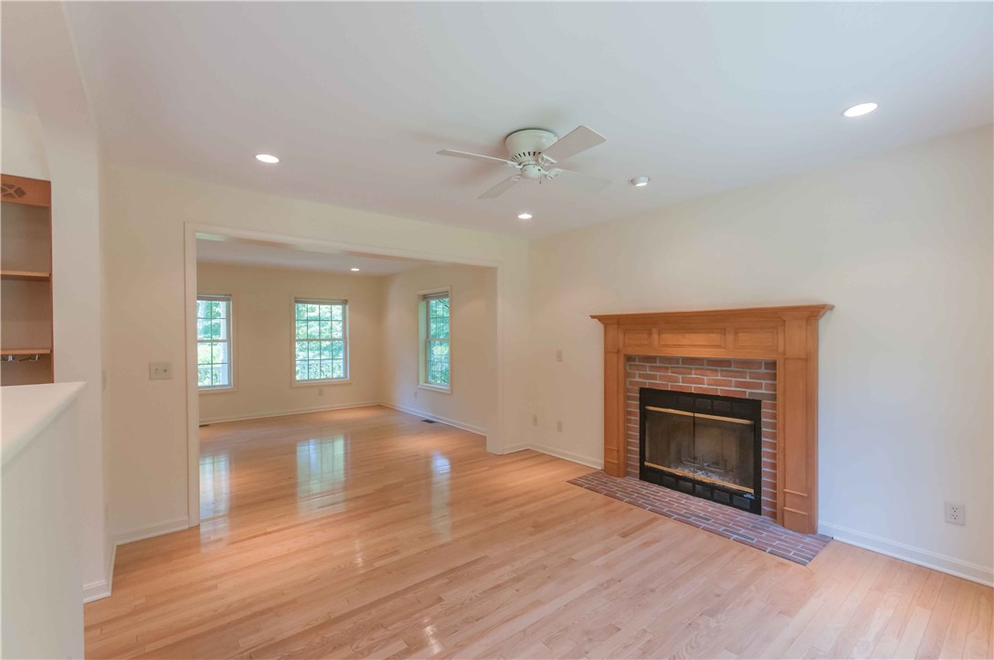 537 Kings Factory Road Charlestown, RI 02813 - Photo 3 of 24 Wood burning fireplace off the kitchen. Great seating area for your guests to stay cozy while you cook!