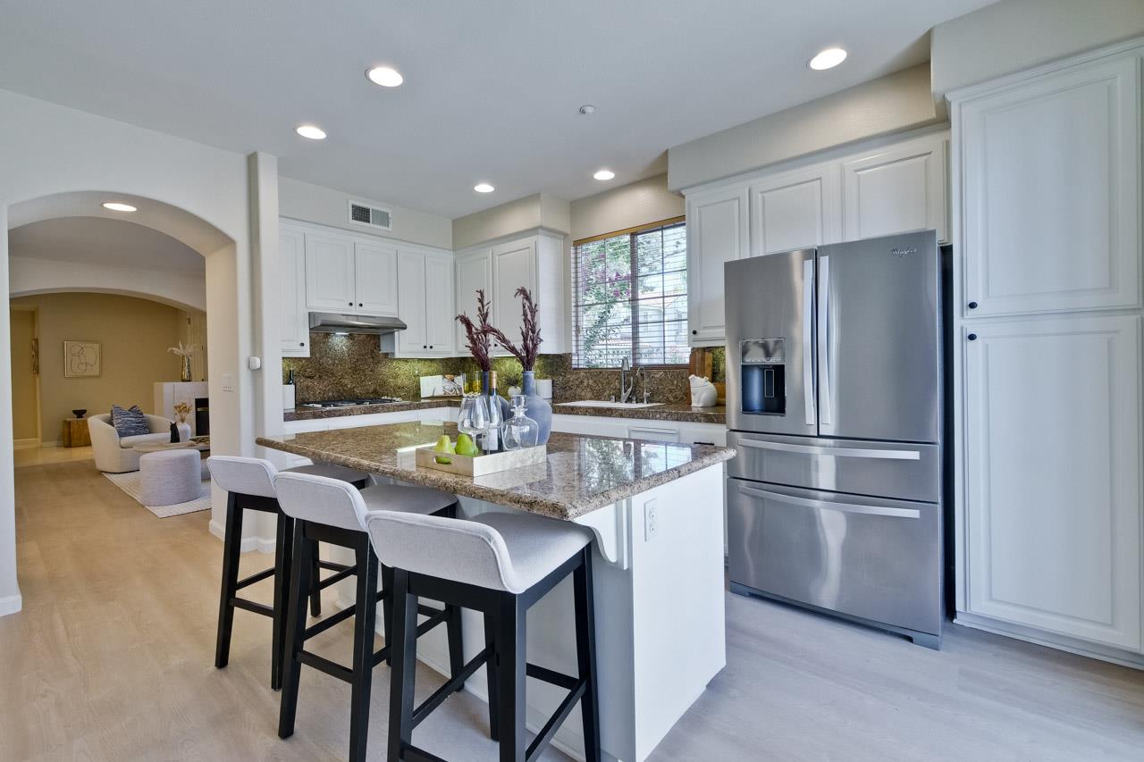 35489 Monterra Circle Union City, CA 94587 - Photo 16 of 52 a kitchen with refrigerator a sink and chairs