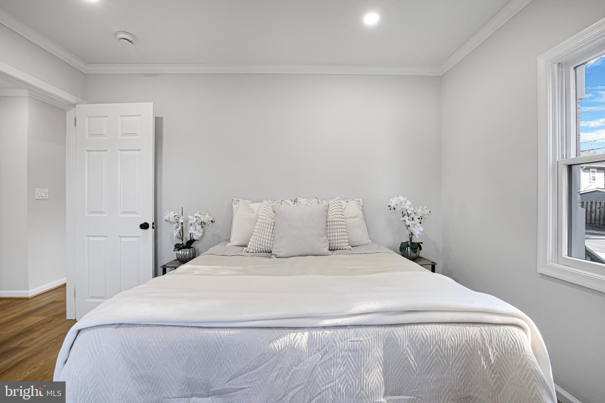 4305 Garrett Park Road Silver Spring, MD 20906 - Photo 17 of 39 a bedroom with a bed and a window