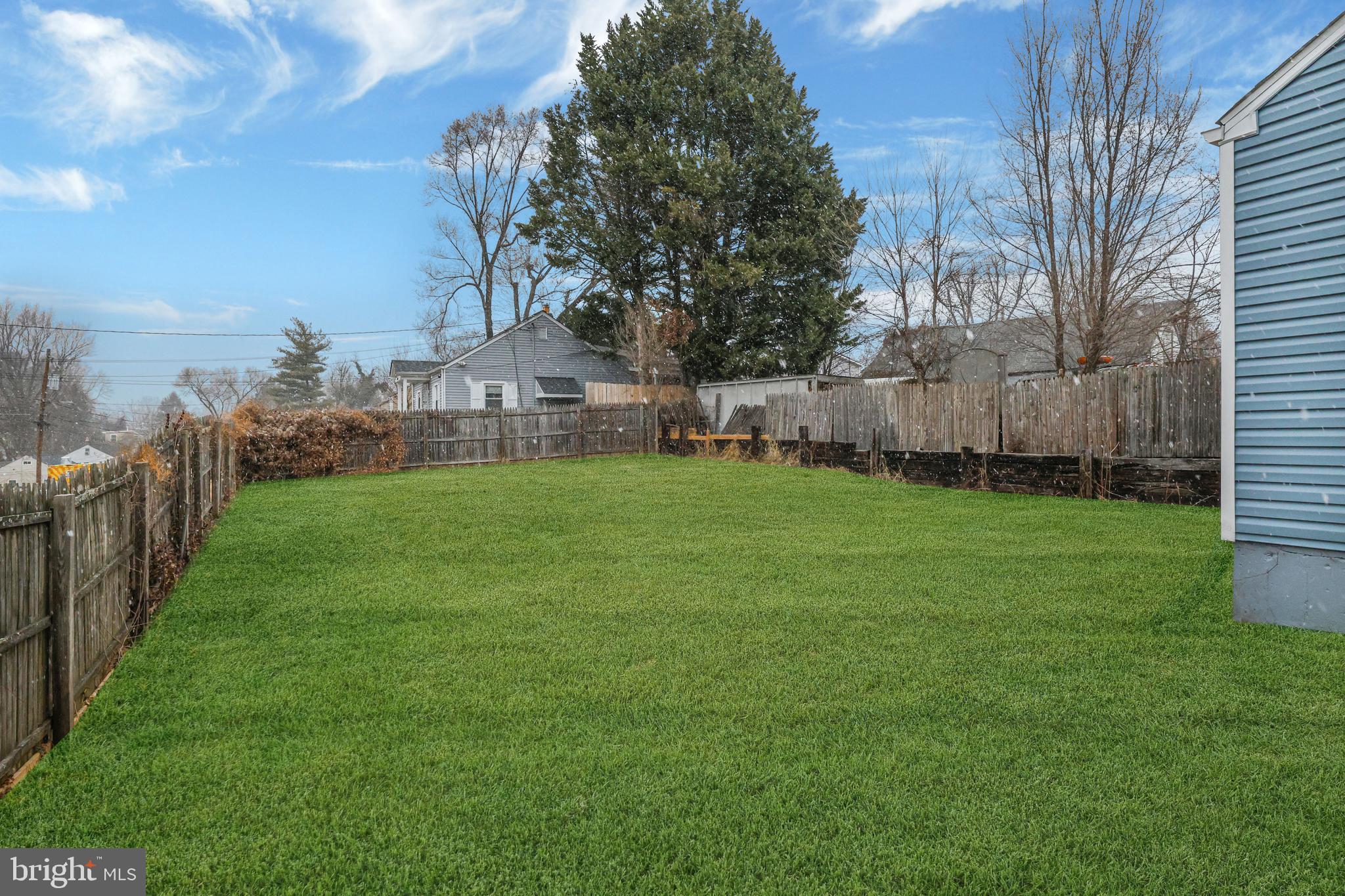 4305 Garrett Park Road Silver Spring, MD 20906 - Photo 37 of 39 a view of a backyard with large trees