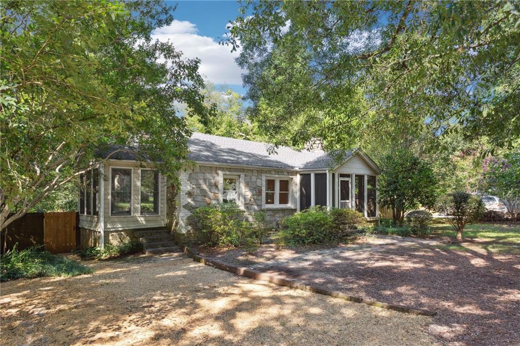 385 Sunset Drive Athens, GA 30606 - Photo 1 of 48 a front view of a house with a garden