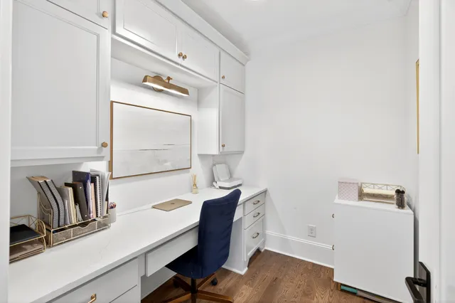 a spacious bathroom with a granite countertop sink and a mirror
