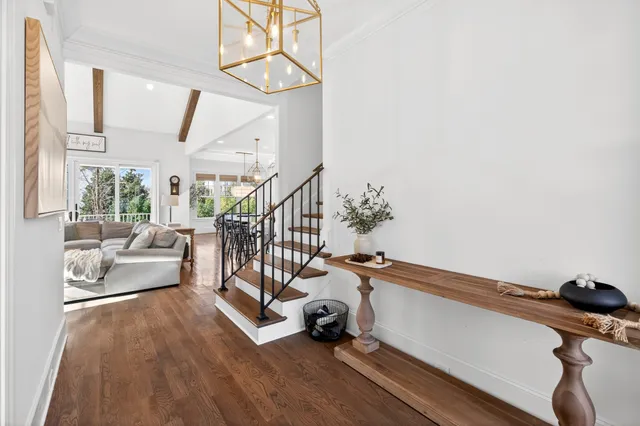 a view of an entryway with wooden floor