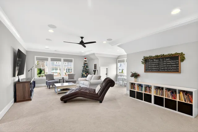 a view of a livingroom with furniture window and wooden floor