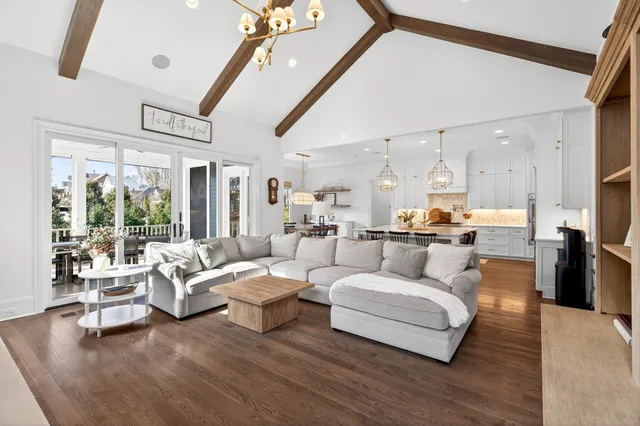 a living room with furniture and kitchen view