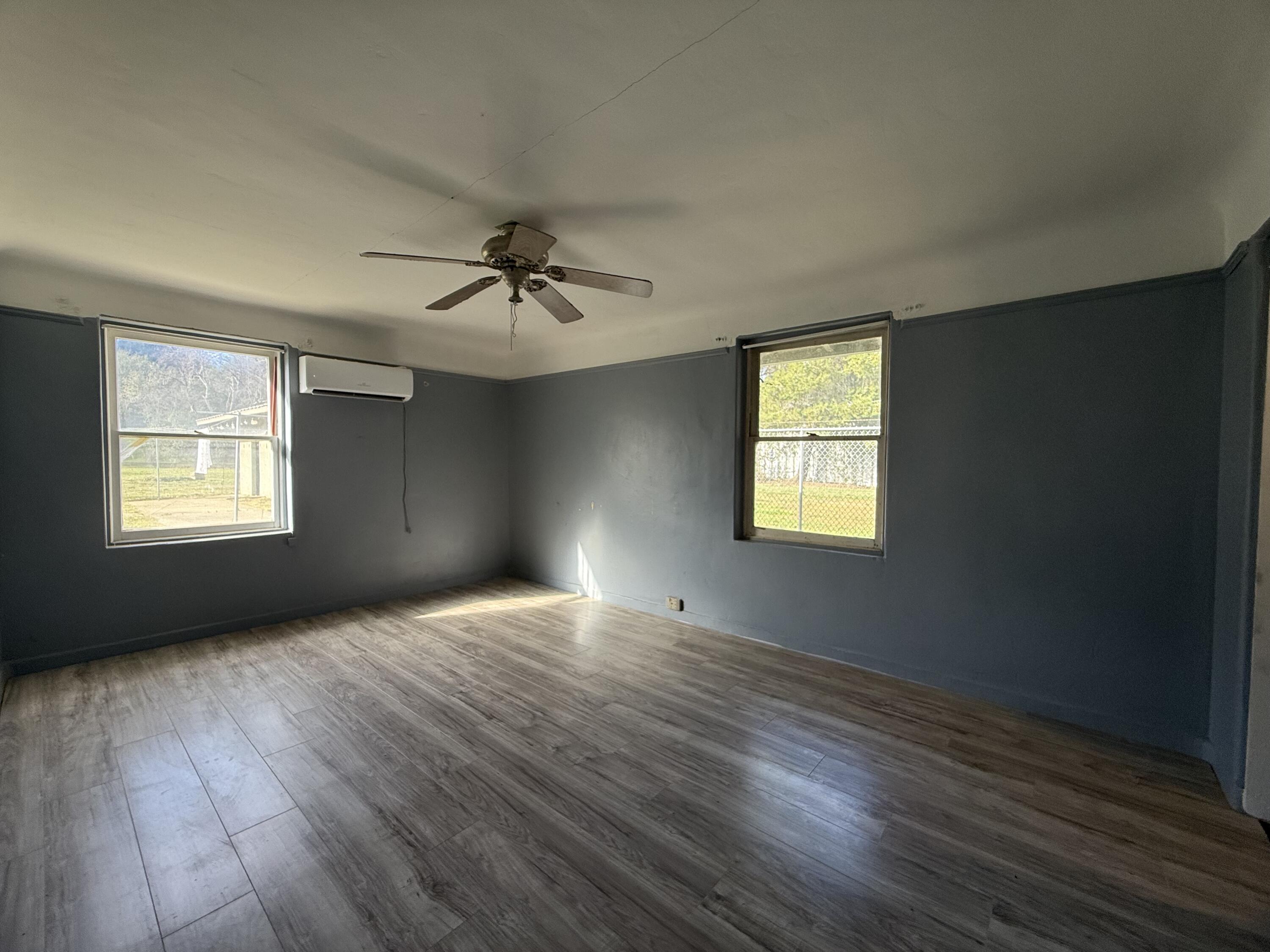 6820 Highway 273 Anderson, CA 96007 - Photo 13 of 35 a view of an empty room window and wooden floor