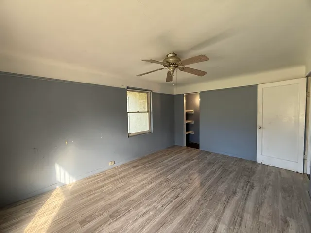 a bathroom with a sink and mirror with toilet