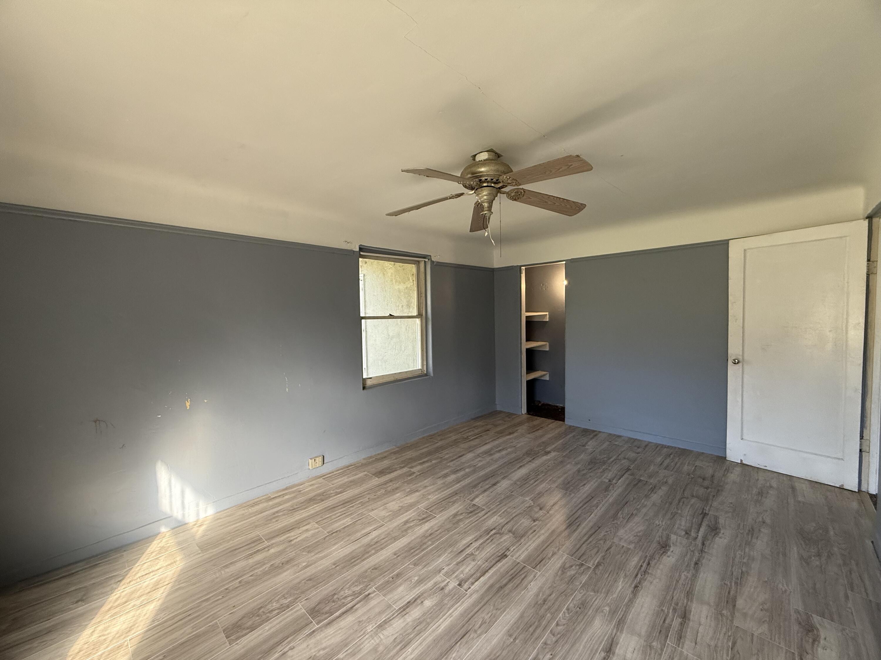 6820 Highway 273 Anderson, CA 96007 - Photo 14 of 35 wooden floor in an empty room with a window
