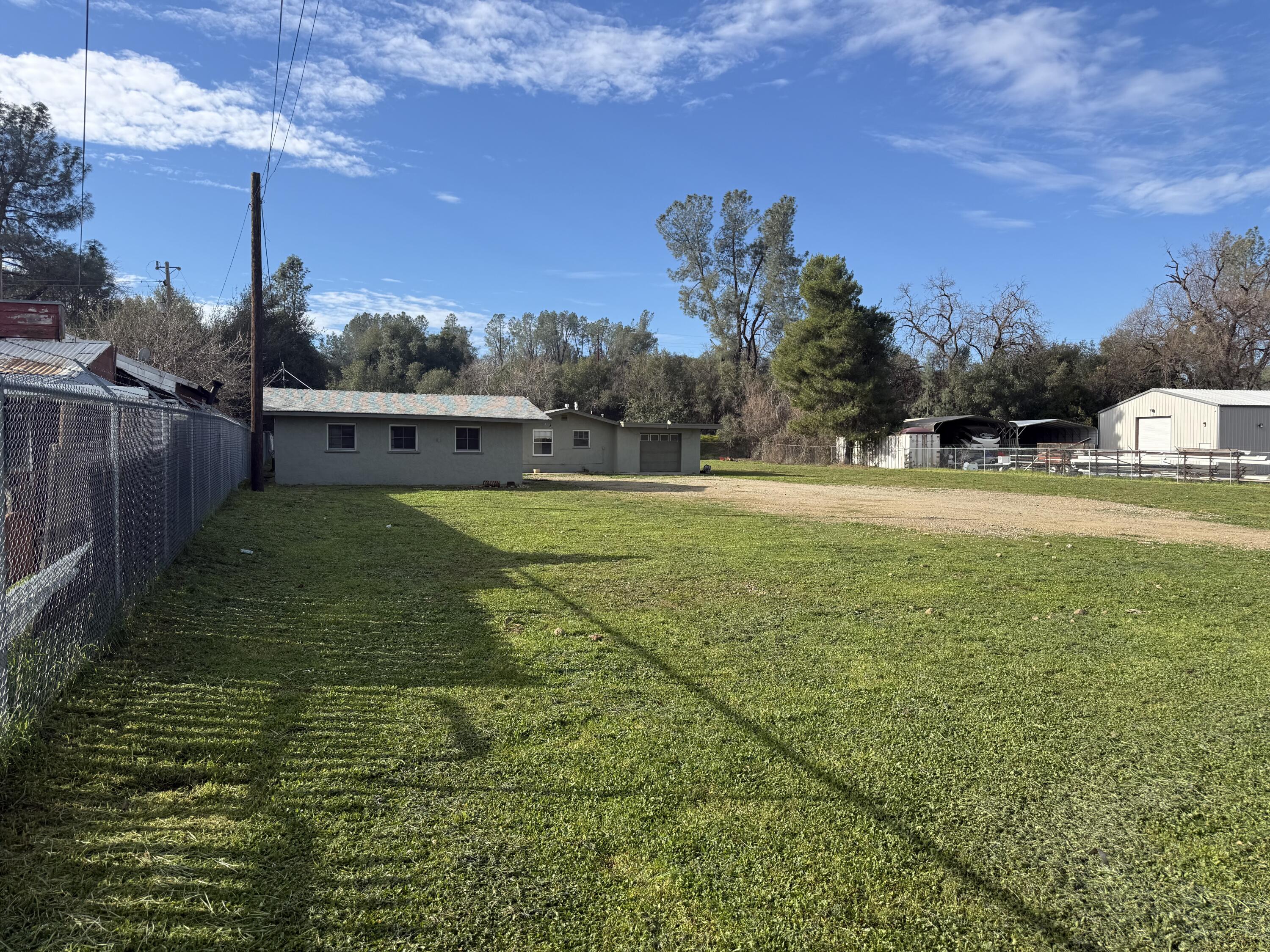 6820 Highway 273 Anderson, CA 96007 - Photo 24 of 35 a view of yard with swimming pool and trees