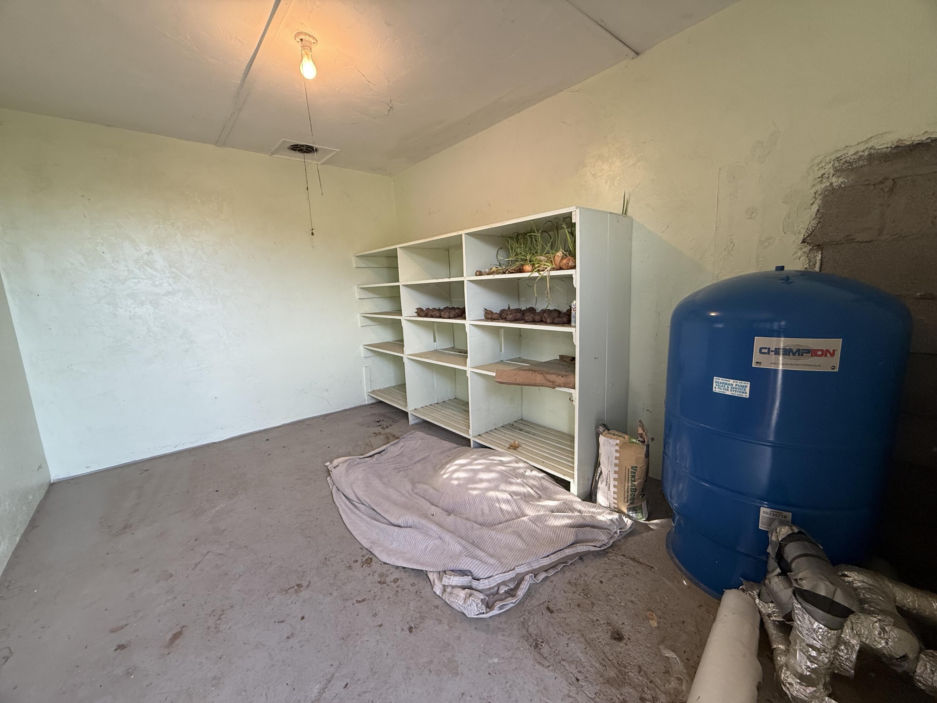 6820 Highway 273 Anderson, CA 96007 - Photo 32 of 35 a room with a chair and storage