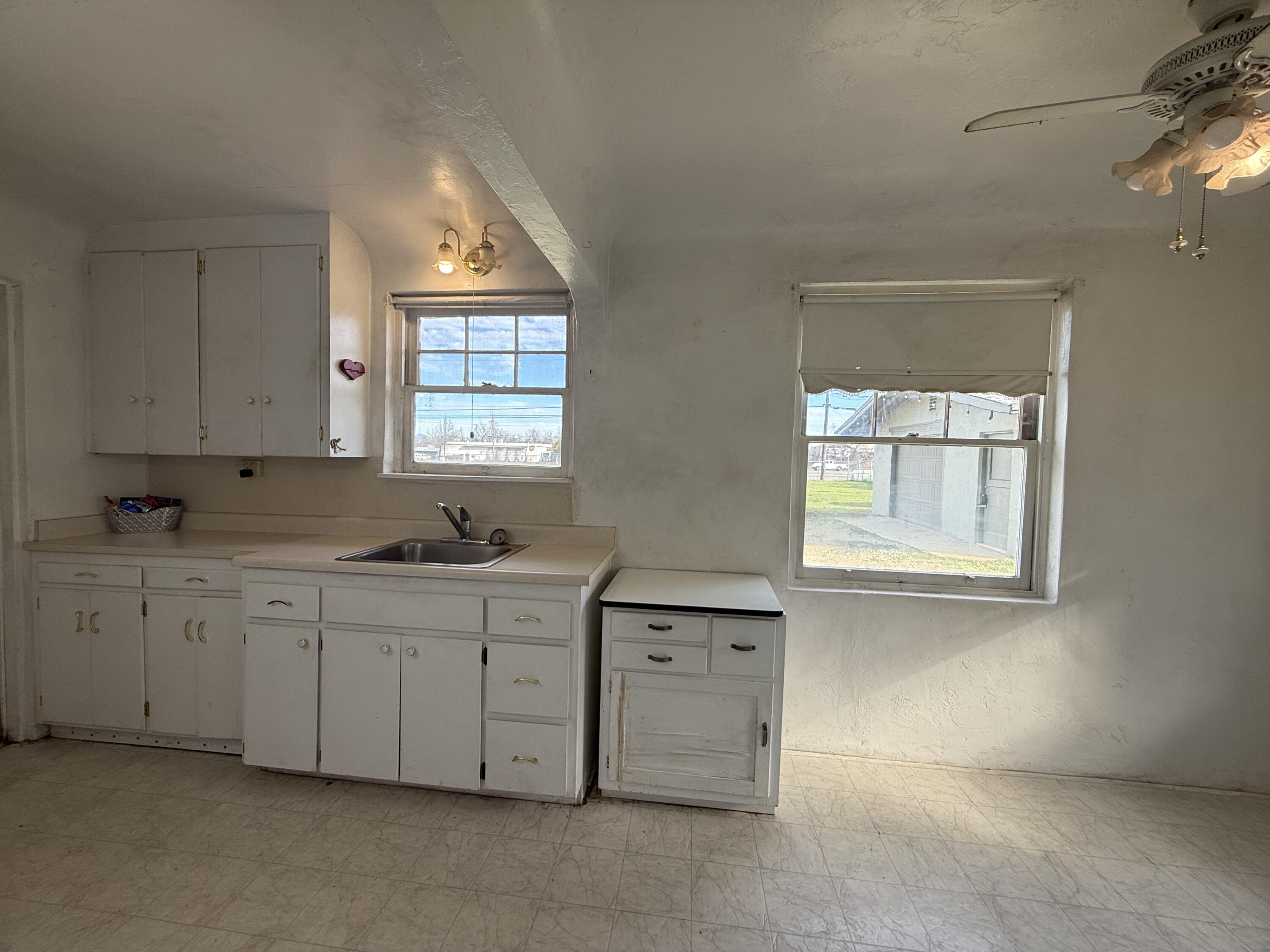 6820 Highway 273 Anderson, CA 96007 - Photo 7 of 35 a kitchen that has a sink and a stove in it