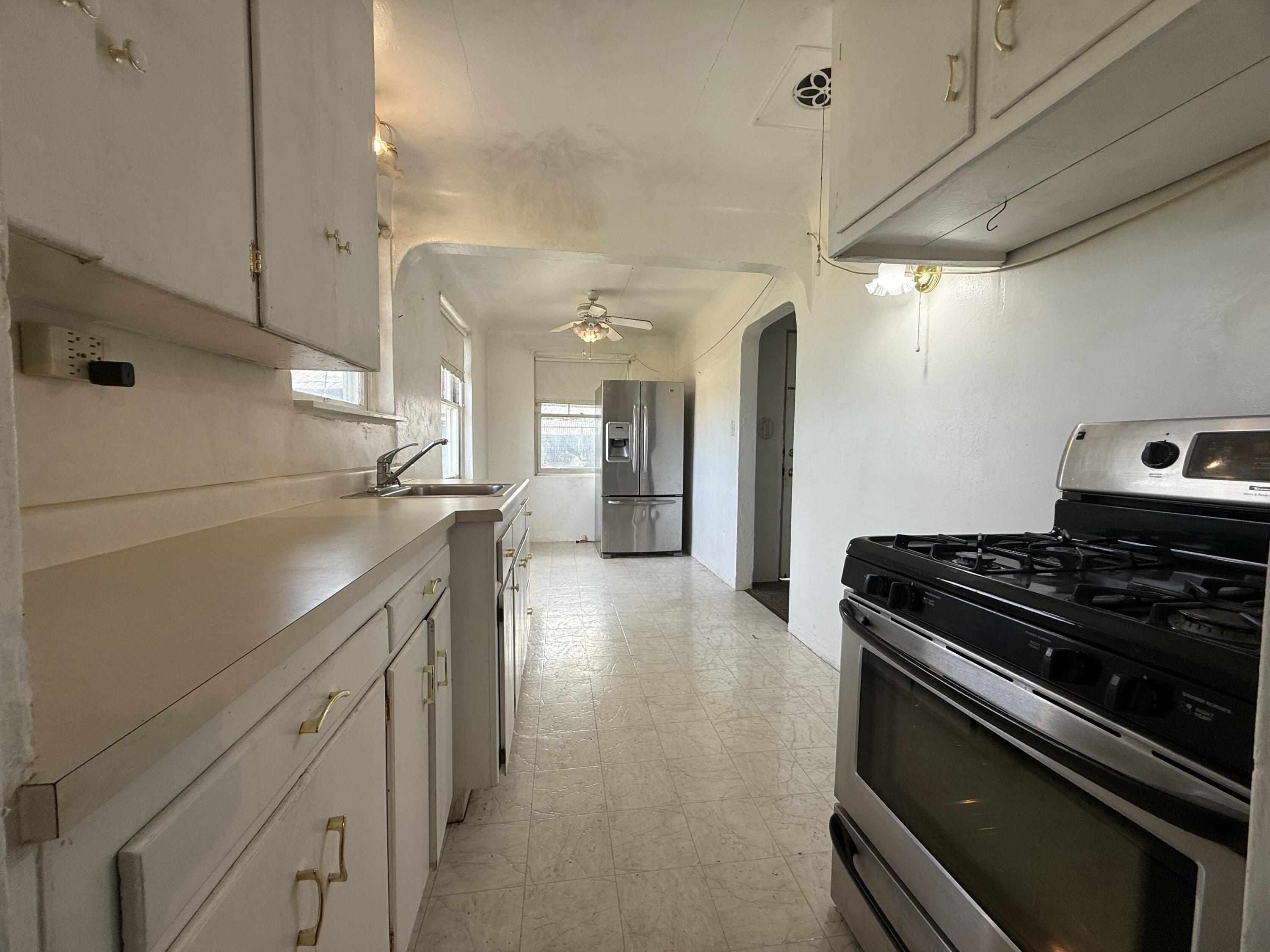 6820 Highway 273 Anderson, CA 96007 - Photo 8 of 35 a kitchen with stainless steel appliances granite countertop a stove and a refrigerator