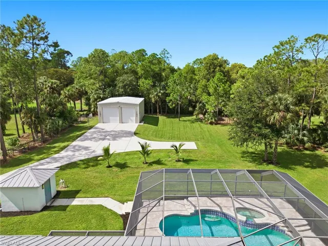a view of a yard with swimming pool