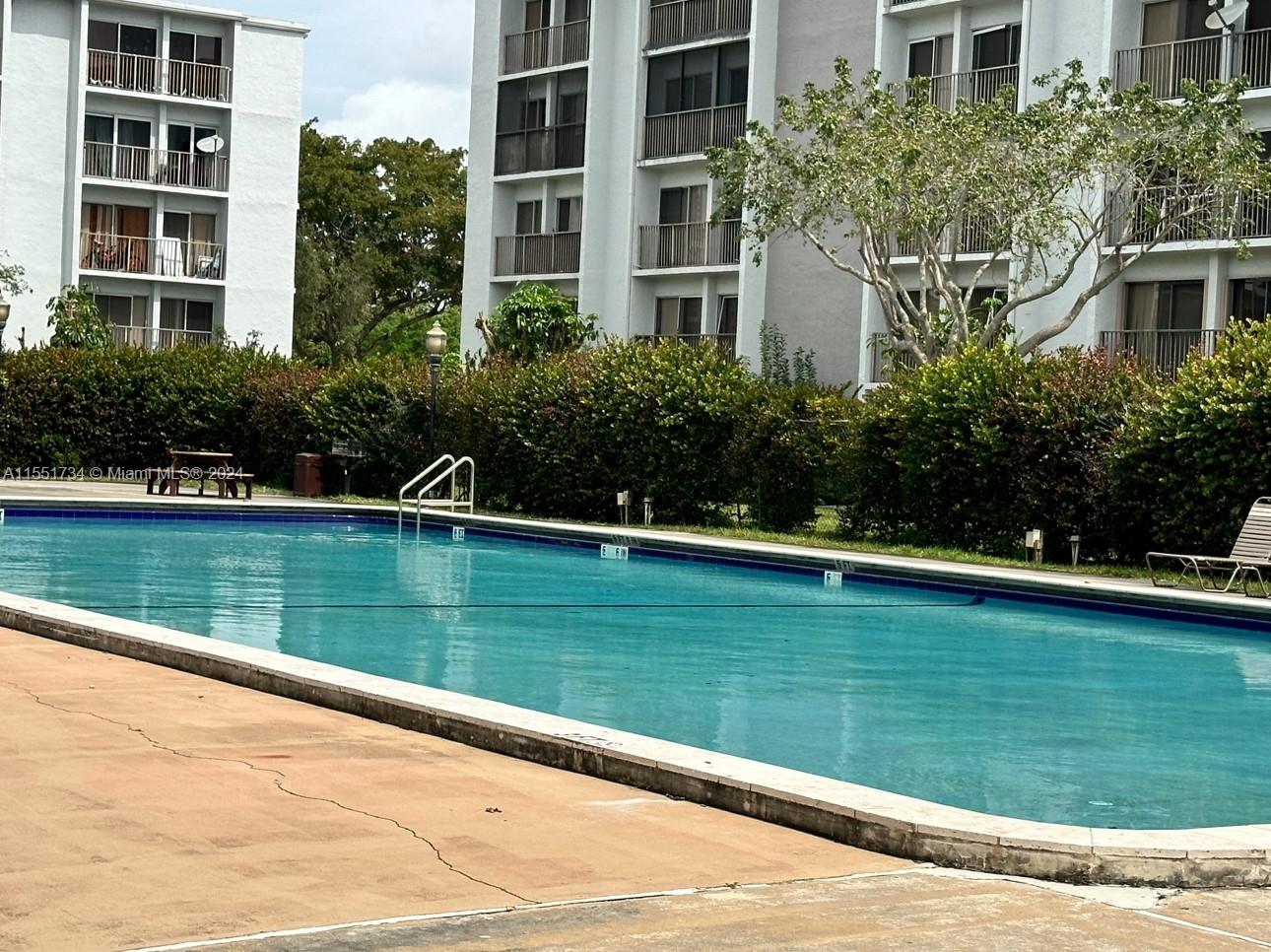 a view of swimming pool with a yard