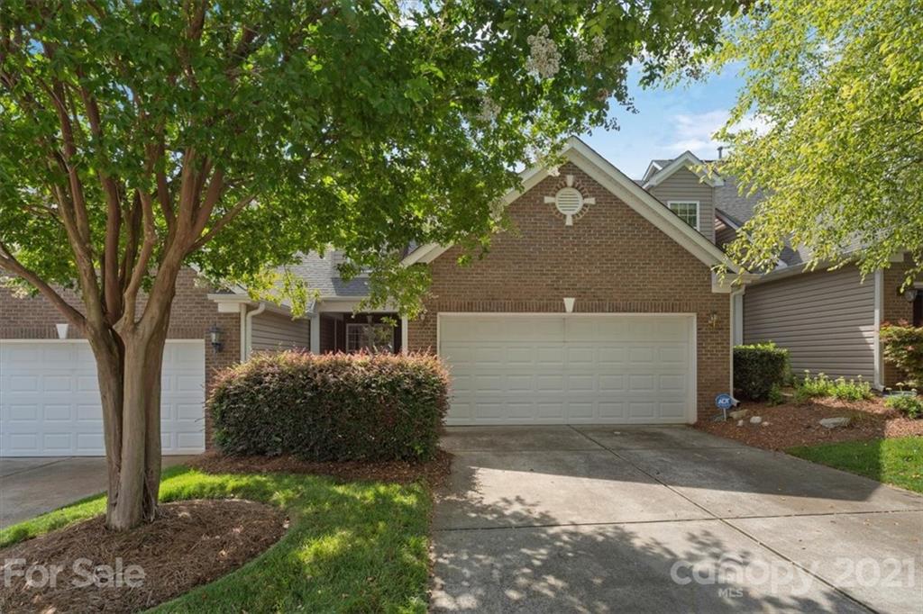257 Garnet Court Fort Mill, SC 29708 - Photo 1 of 43 a front view of a house with a yard and garage