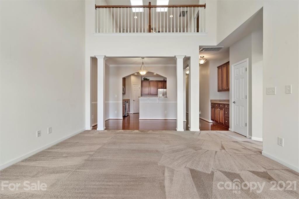 257 Garnet Court Fort Mill, SC 29708 - Photo 12 of 43 a view of a hallway with a white walls