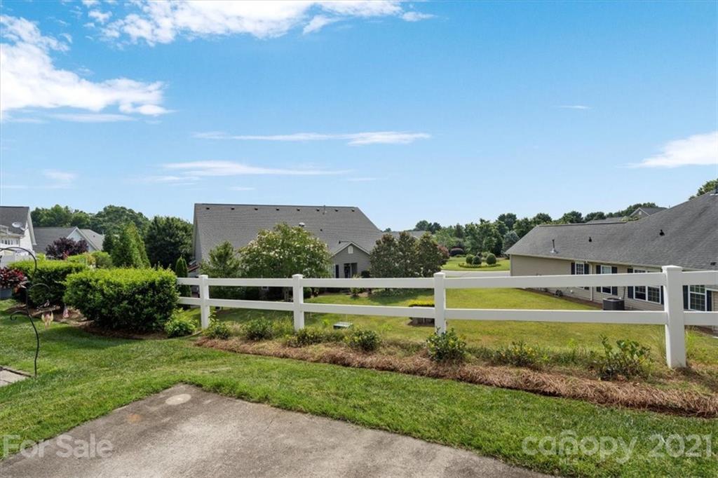 257 Garnet Court Fort Mill, SC 29708 - Photo 17 of 43 a view of a lake with a yard