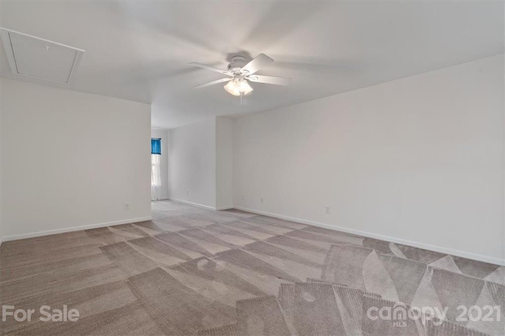 257 Garnet Court Fort Mill, SC 29708 - Photo 20 of 43 a view of an empty room with chandelier fan