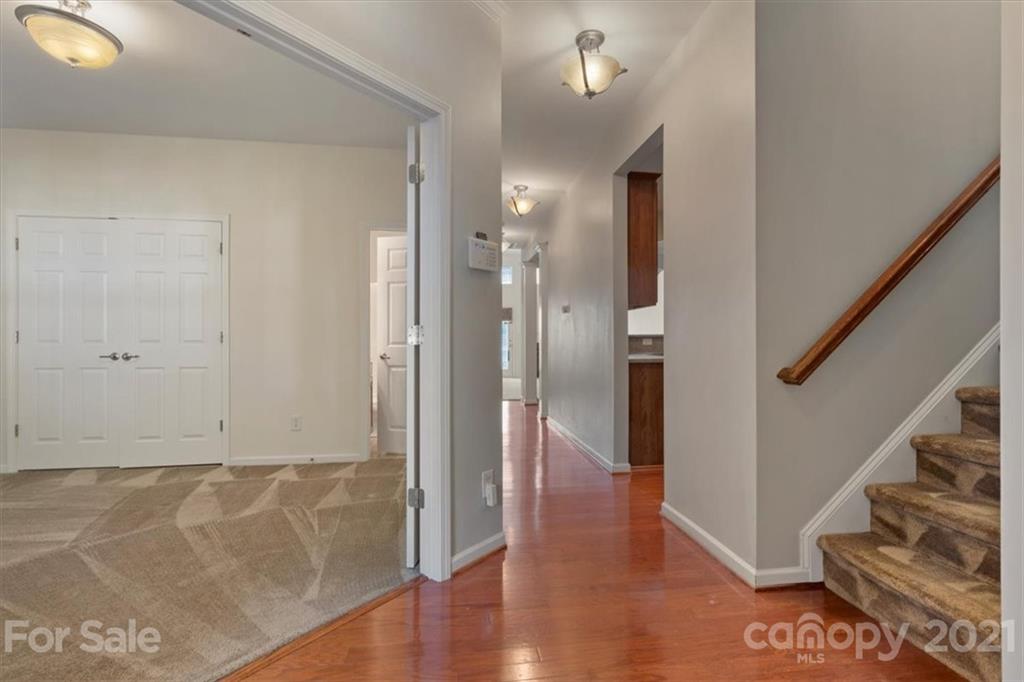 257 Garnet Court Fort Mill, SC 29708 - Photo 21 of 43 a view of a hallway view with wooden floor and staircase