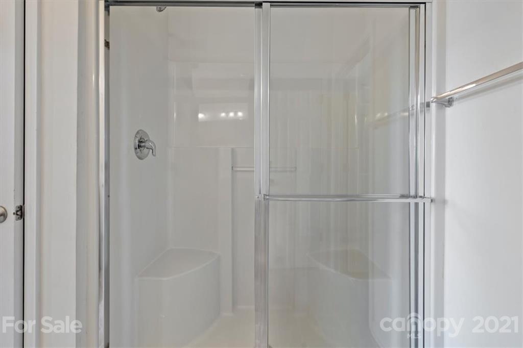 257 Garnet Court Fort Mill, SC 29708 - Photo 28 of 43 a bathroom with a glass shower door
