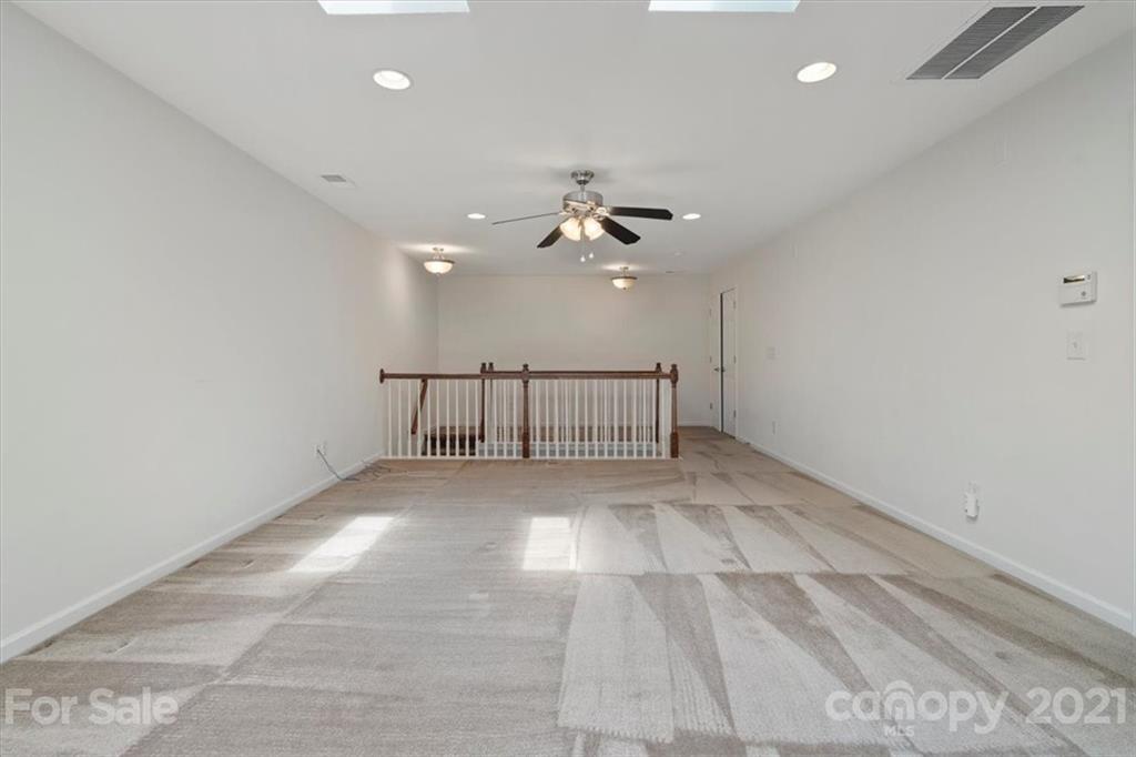 257 Garnet Court Fort Mill, SC 29708 - Photo 34 of 43 a view of a livingroom with a ceiling fan and window