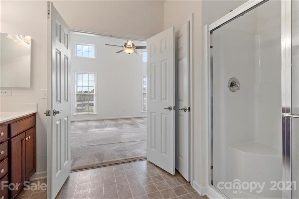 257 Garnet Court Fort Mill, SC 29708 - Photo 7 of 43 a bathroom with a shower and a glass door
