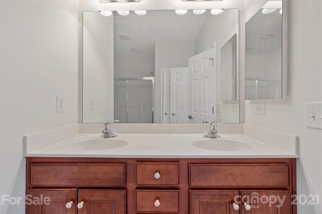 257 Garnet Court Fort Mill, SC 29708 - Photo 8 of 43 a bathroom with a sink and a mirror