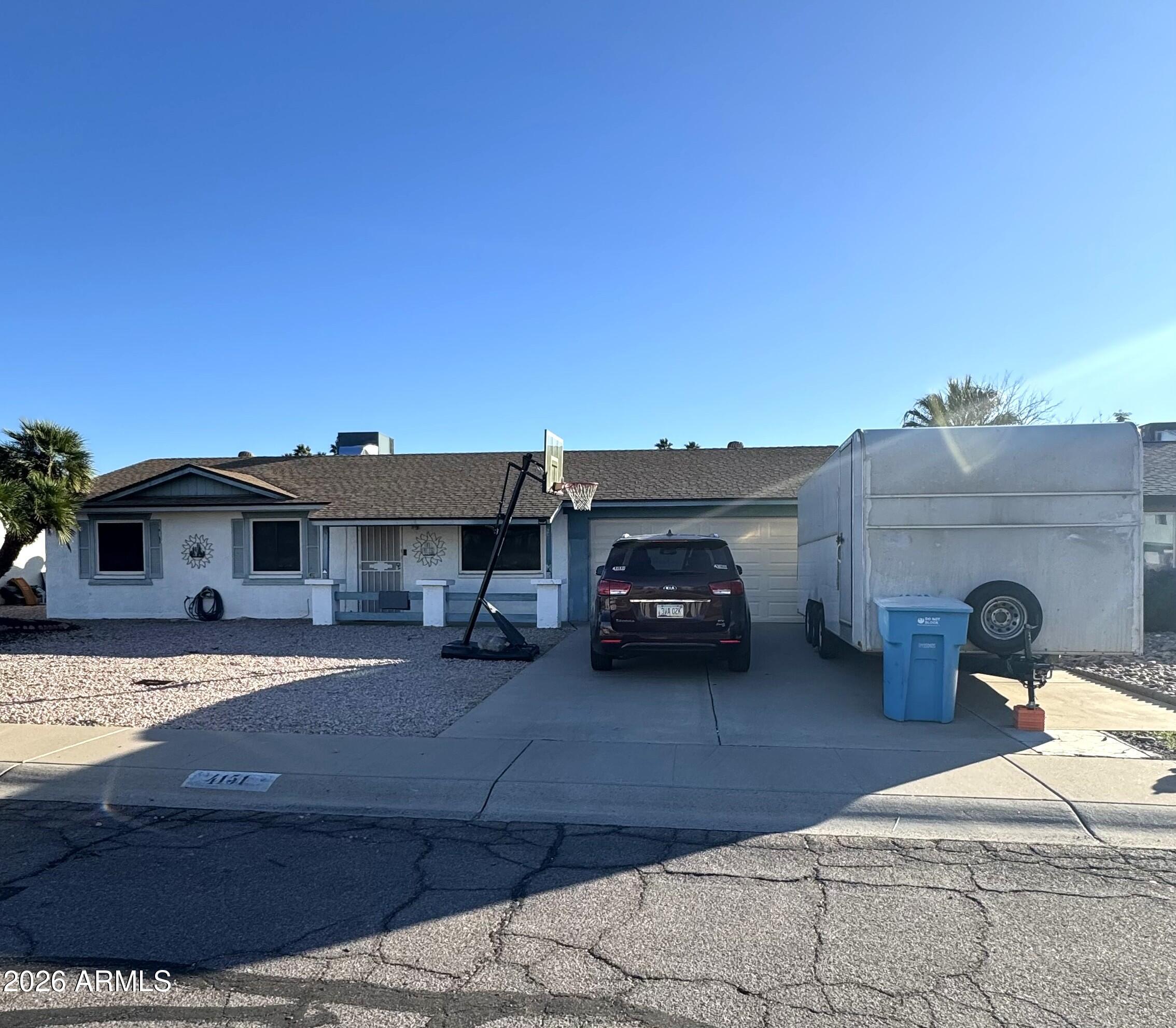 a view of a car park in front of the house