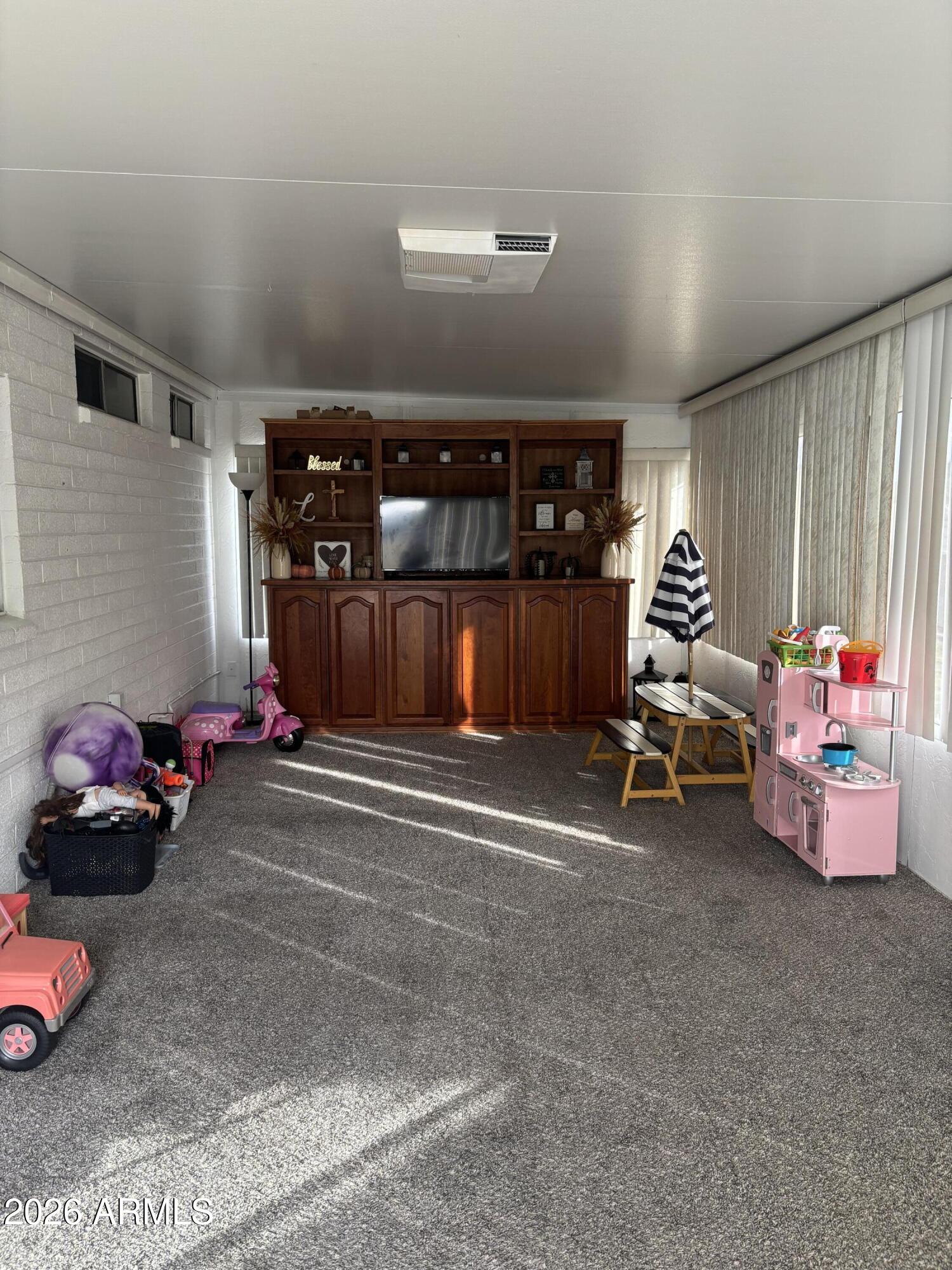 4151 West Shaw Butte Drive Phoenix, AZ 85029 - Photo 11 of 17 a bedroom with furniture and a window