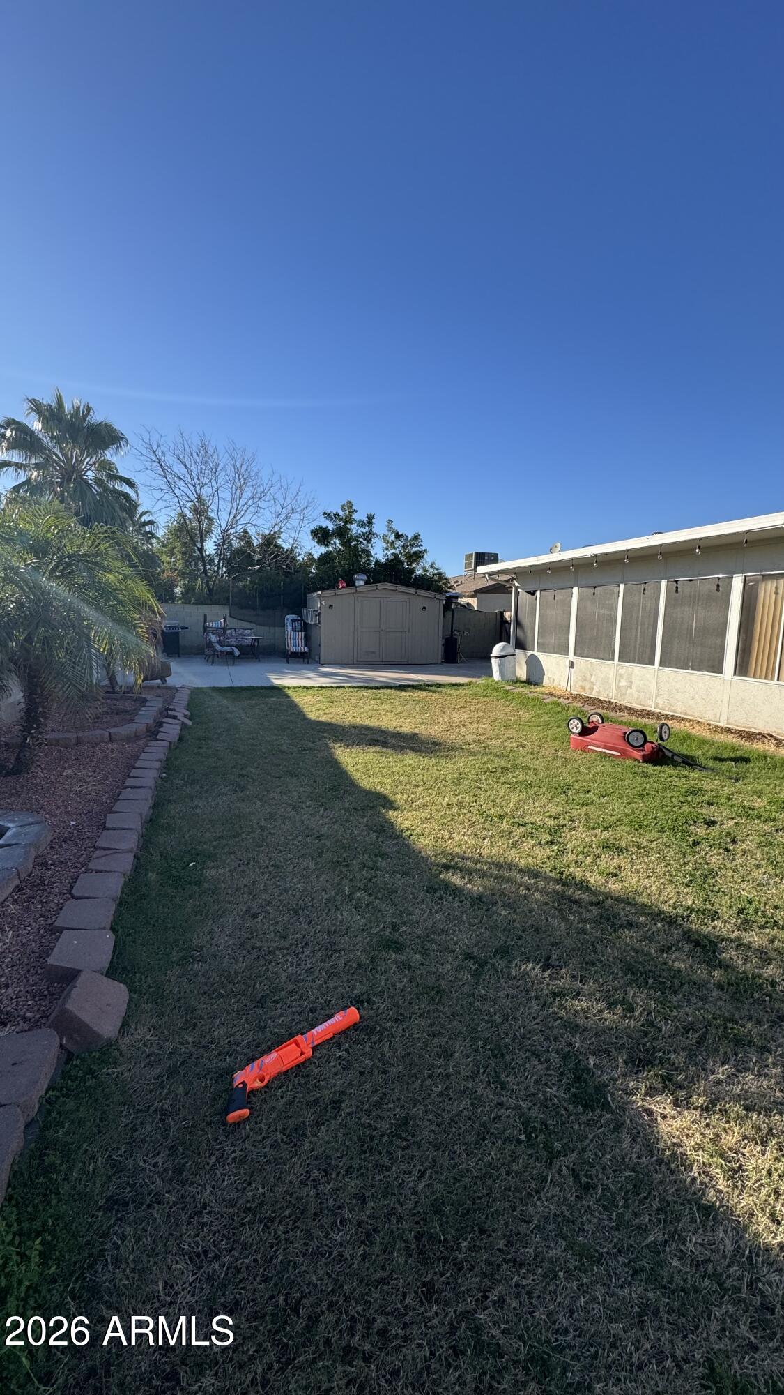 4151 West Shaw Butte Drive Phoenix, AZ 85029 - Photo 13 of 17 a view of a house with a yard