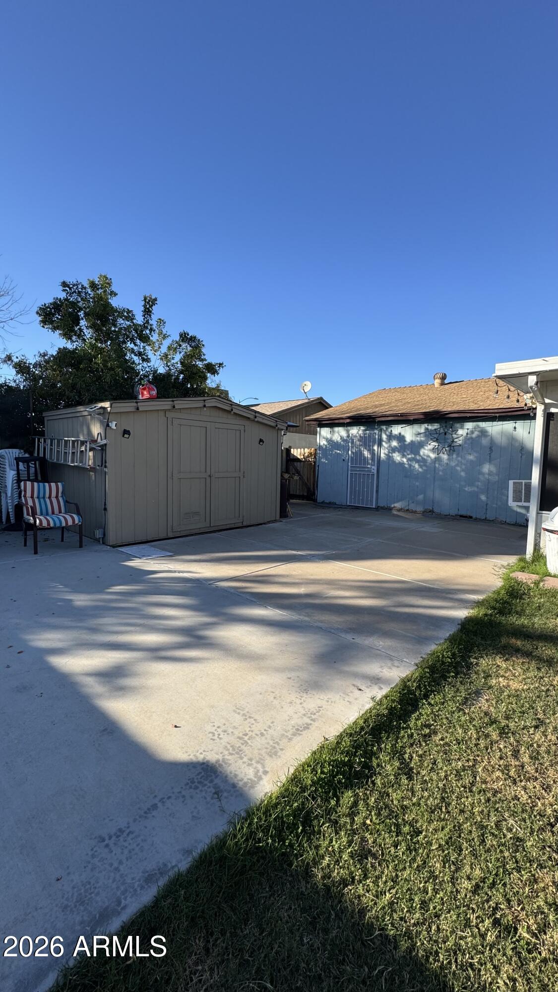 4151 West Shaw Butte Drive Phoenix, AZ 85029 - Photo 15 of 17 a view of a swimming pool with a yard