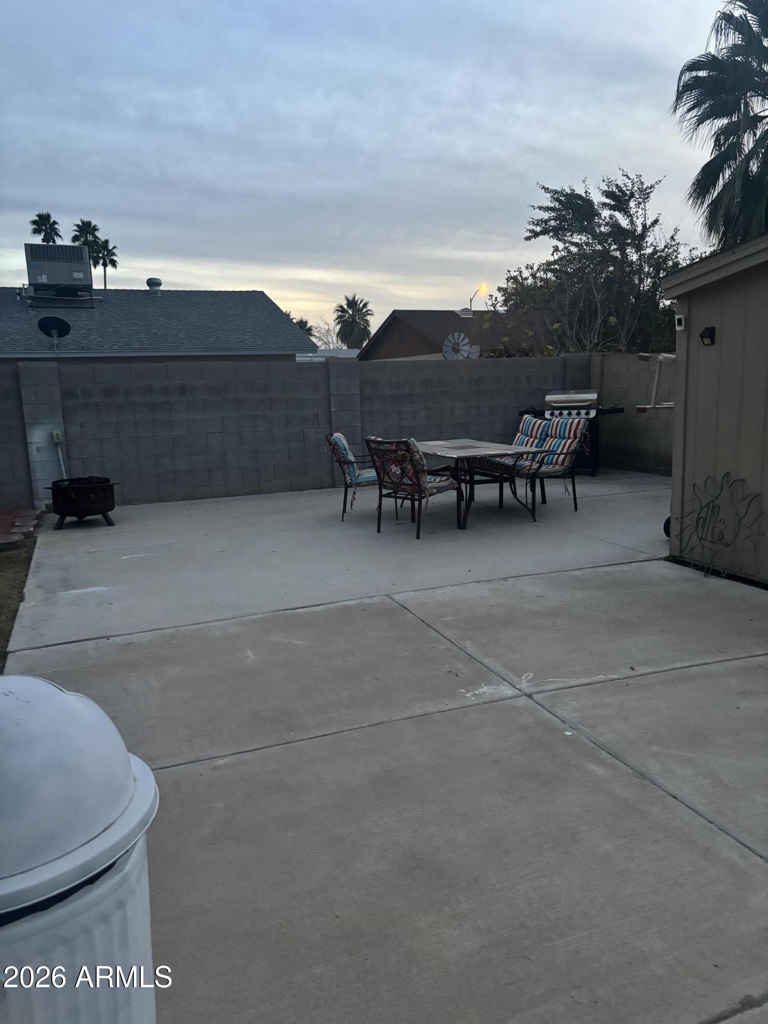4151 West Shaw Butte Drive Phoenix, AZ 85029 - Photo 16 of 17 a view of a patio with table and chairs and potted plants