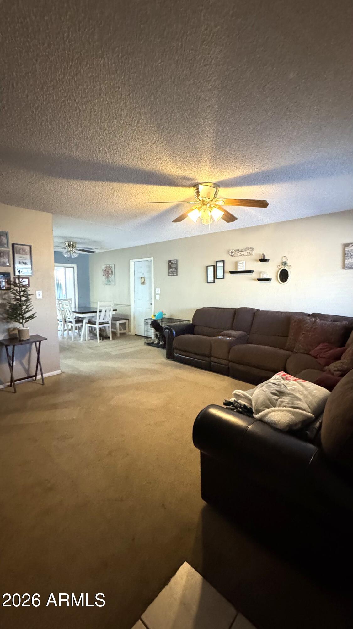 4151 West Shaw Butte Drive Phoenix, AZ 85029 - Photo 2 of 17 a living room with furniture and a large window