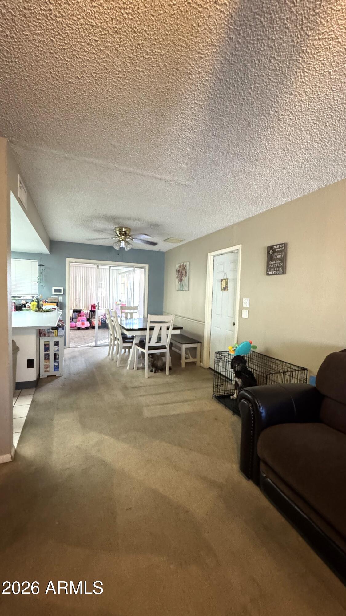4151 West Shaw Butte Drive Phoenix, AZ 85029 - Photo 3 of 17 a living room with furniture and a flat screen tv