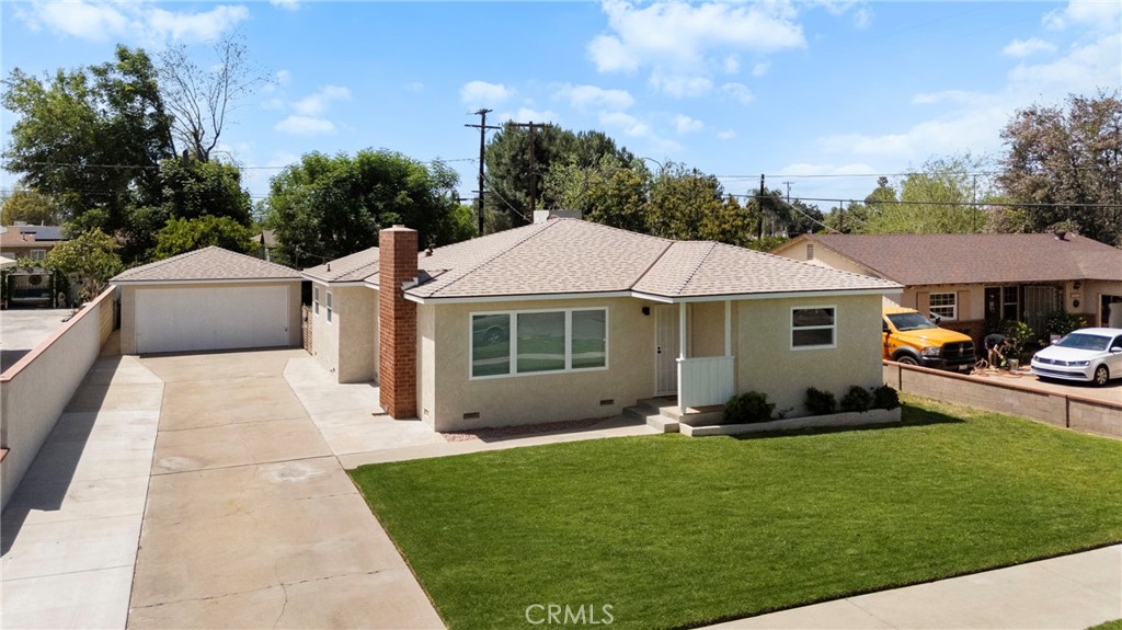 3956 Donald Avenue Riverside, CA 92503 - Photo 1 of 1 a front view of a house with a garden