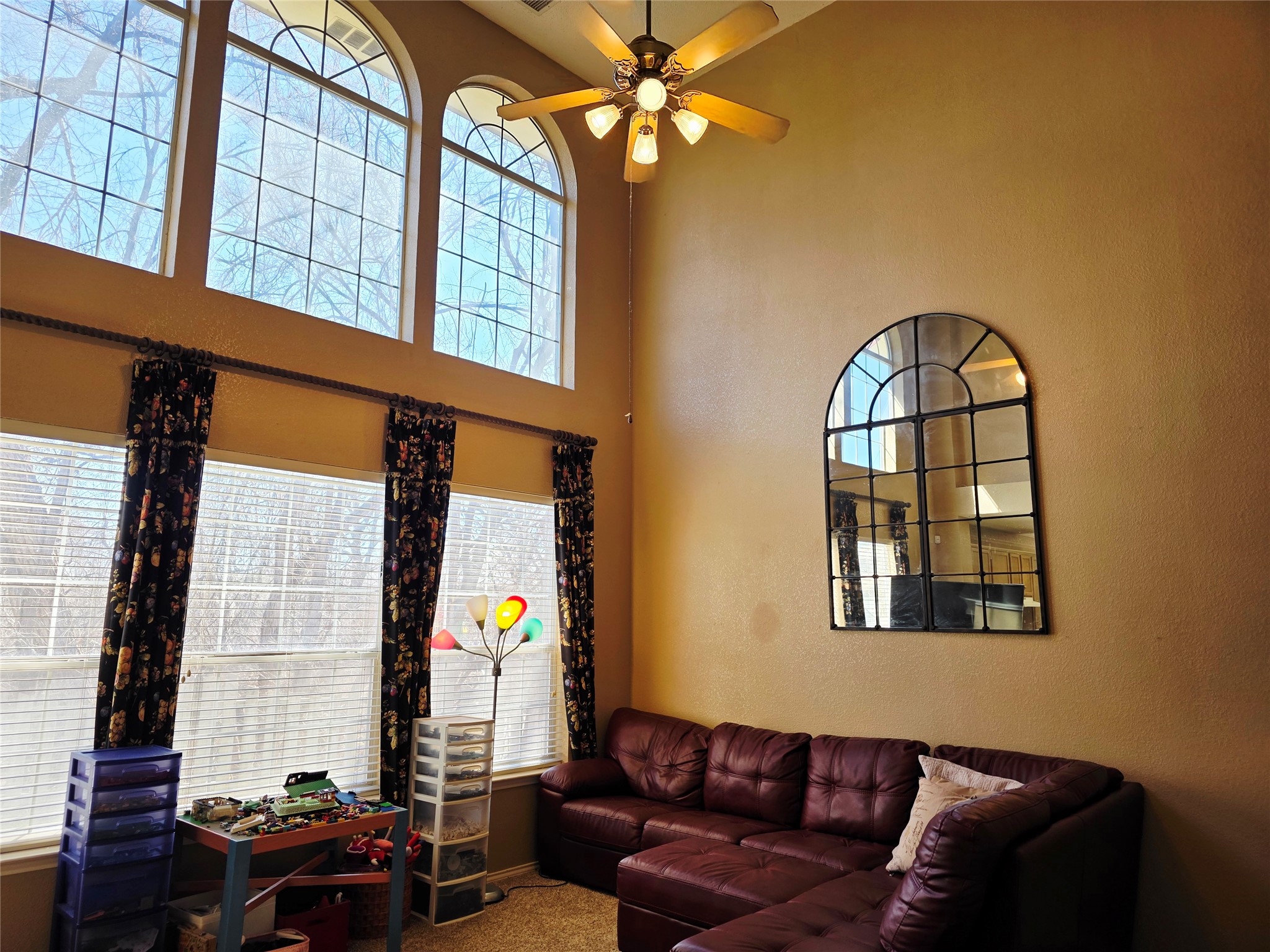 16303 Ascent Cove Pflugerville, TX 78660 - Photo 6 of 26 Living room with tall windows and high ceilings