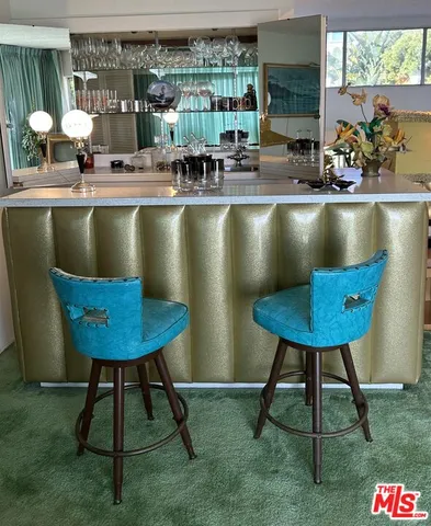 a view of a table and chairs in patio