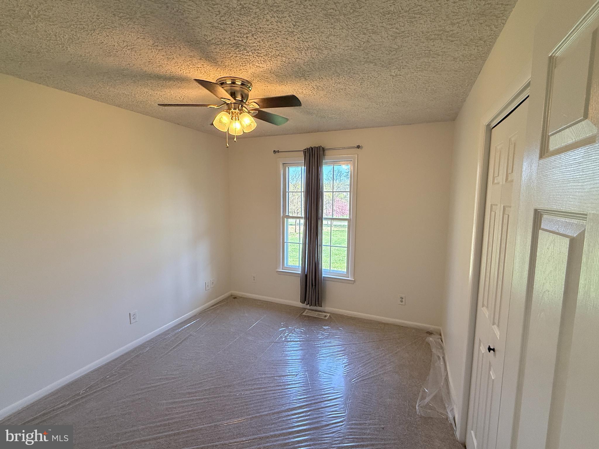 5572 Old Bust Head Road Broad Run, VA 20137 - Photo 20 of 30 a view of an empty room with a window